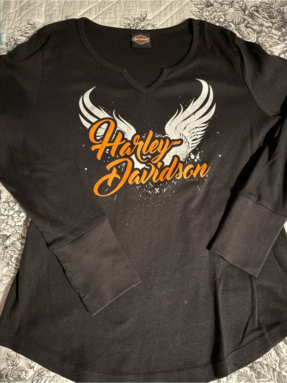 Laconia Harley-Davidson Black Long Sleeve Tee with Orange Script & White Wings